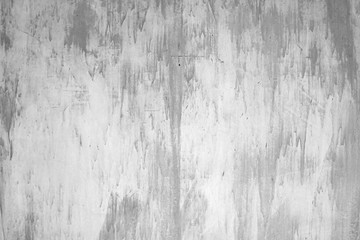 Raw old cement or concrete or plaster wall with stains and cracks for background and texture.