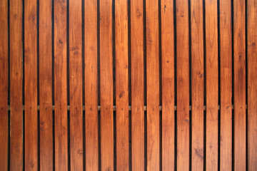 Old vintage red brown wood lath wall cladding for background and texture images.