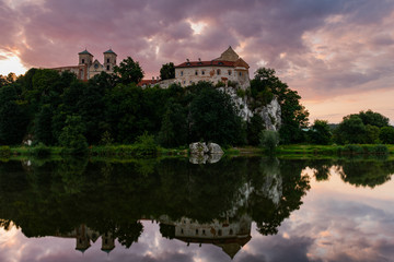 Fototapeta na wymiar Benedictine Abbey and Monastery on the Hill in Tyniec near Cracow, Poland. Riverside of Vistula River at Sunrise