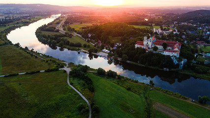 Picturesque Tyniec near Krakow, Poland. Benedictine Abbey, Monastery and Church on the Cliff by Vistula River. Aerial Drone View at Sunrise