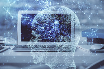 Multi exposure of work table with computer and brain hologram. Brainstorm concept.