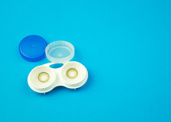 Contact lens on blue background