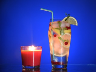 an evening cocktail. fruit evening cocktail, cocktail by candlelight