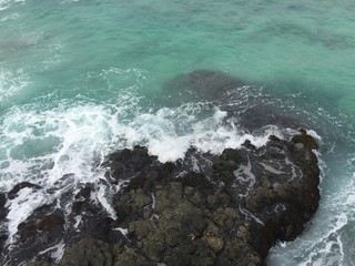 waves crashing on rocks