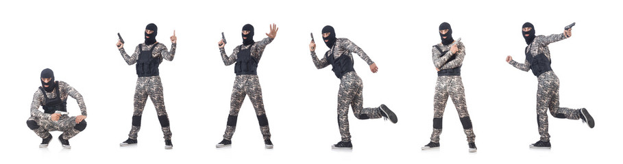 Soldier in camouflage with gun on white