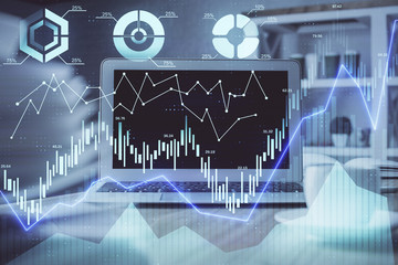 Forex market chart hologram and personal computer background. Double exposure. Concept of investment.