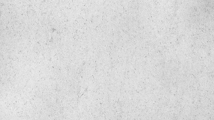 Monohrome grainy gray abstract background. Grunge plastered wall texture, concrete cement background.