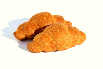 Croissant for breakfast crispy, fresh and aromatic isolated on white background.