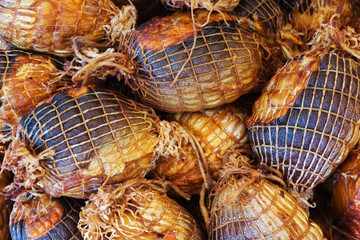 Sausage from fish. Baked fish in the forming grid. Trade in fish products.