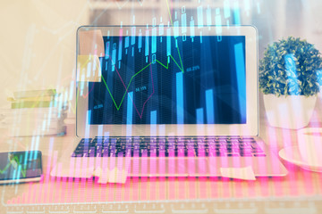 Stock market graph and table with computer background. Multi exposure. Concept of financial analysis.