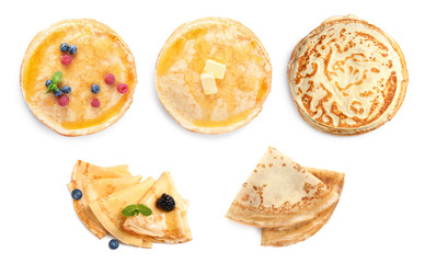 Set of tasty thin pancakes on white background, top view. Banner design