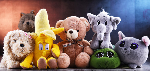 Group of stuffed animal toys in a children's room