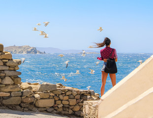 Girl amazed by this Mykonos view - obrazy, fototapety, plakaty