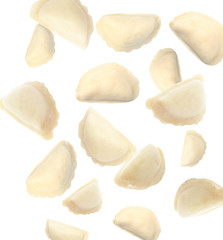 Many tasty dumplings falling on white background