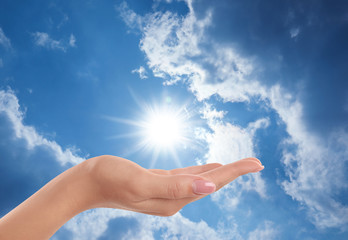 Bright light in hand, closeup. Solar energy concept