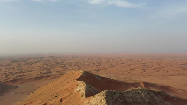 Drone view of Fossil Rocks in Dry Desert with Sand Ripples, Geological Landscape of High Dune Desert in United Arab Emirates 
