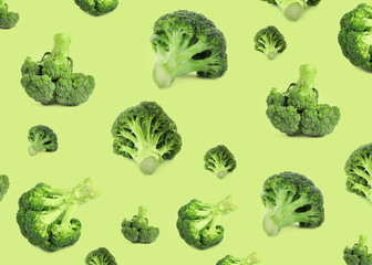 Pattern of fresh green broccoli on light green background