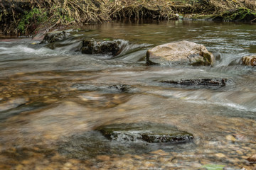 The current of the river between the stones