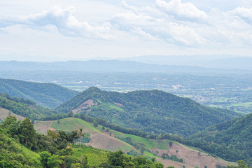 Fototapeta premium Scenic view of mountains against cloud sky