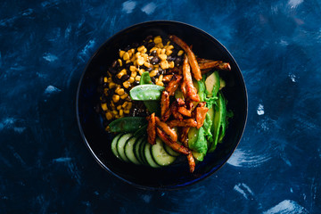 plant-based food, vegan poke bowl with beans corn avocado cucumber and air fried marinated tofu