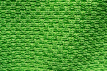 Green sports clothing fabric football shirt jersey texture close up