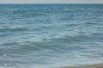 Close-up of sand on the beach and water of the Yarovoe salt lake (Altai Territory).