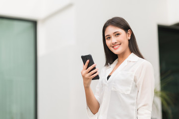 Young asian beautiful women using smartphone .