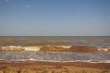 Close-up of sand on the beach and water of the Yarovoe salt lake (Altai Territory).