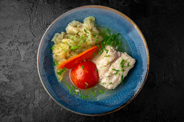 Chicken broth with vegetables and meat. Balanced tasty diet food. First course
