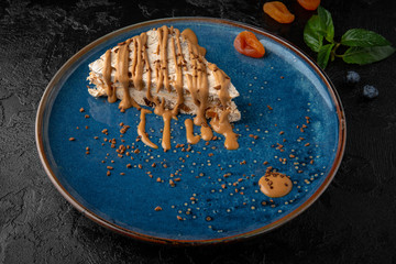 Portion of sour cream or honey cake