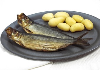 Plate with Potatoes and Smoked Herring or Bouffi Bloater, clupea harengus