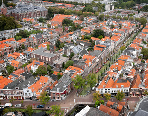 Fototapeta na wymiar Aerial view of the Dutch city Delft. Diagonal street with red-roofed houses