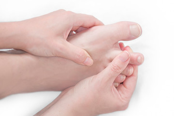 Bare feet feel pain with foot massage