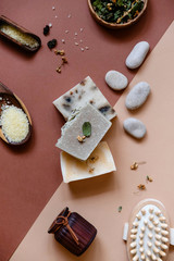Handmade soap bars on color background. Flat lay composition.