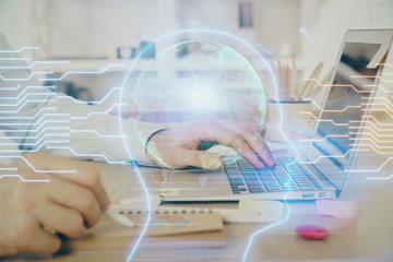 Man typing on keyboard background with brain hologram. Concept of big Data. Double exposure.