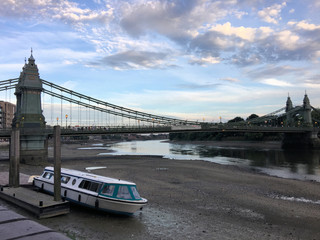 A view of the River Thames at Hamersmith in the eveing near the bridge