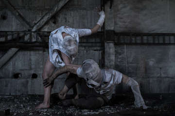Fototapeta premium Dirty monsters boy and girl with bandaged faces