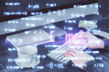 Science formula hologram with man working on computer on background. Education concept. Double...