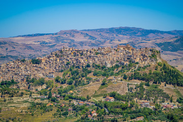 Fototapeta na wymiar Sicilian landscapes with the amazing medieval stone town of Leonforte on the hill in the province of Enna, Sicily, Italy