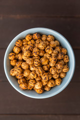 Roasted Chickpea in a bowl on wooden background. Turkish known as leblebi