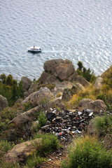 Burnt garbage accumulated on the way to Mount Calvario (Calvary), a religious place and viewpoint of the city of Copacabana and Lake Titicaca, in Bolivia.