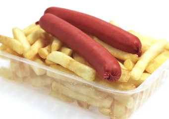 Sausage and French Fries against White Background