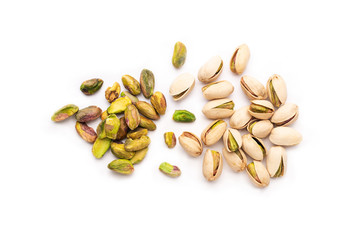 Group of pistachios with white background some of them peeled