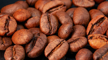 Coffee beans and ground coffee in a macro shot, close-up