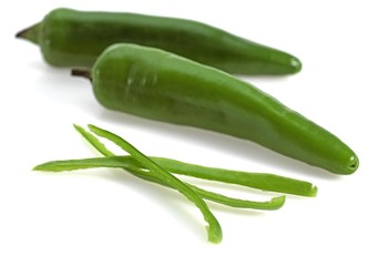 Green Chili Pepper, capsicum annuum against White Background
