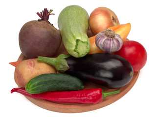 Colorful vegetables on a wooden board, almost all summer vegetables
