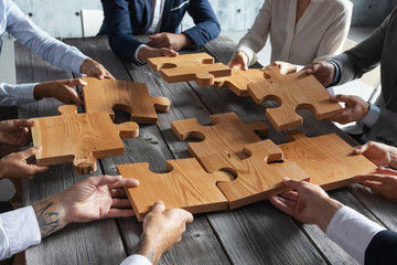 Business people and puzzle pieces