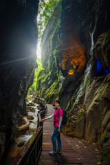 Obraz premium A woman stand at the Zhaoyang ground beam in Hunan, China