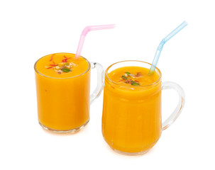 Fresh mango fruit juice on white background