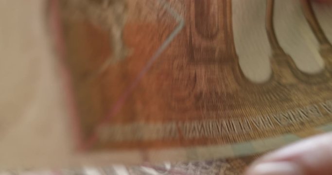 One thousand Macedonian denars banknotes closeup, slowly counting the money